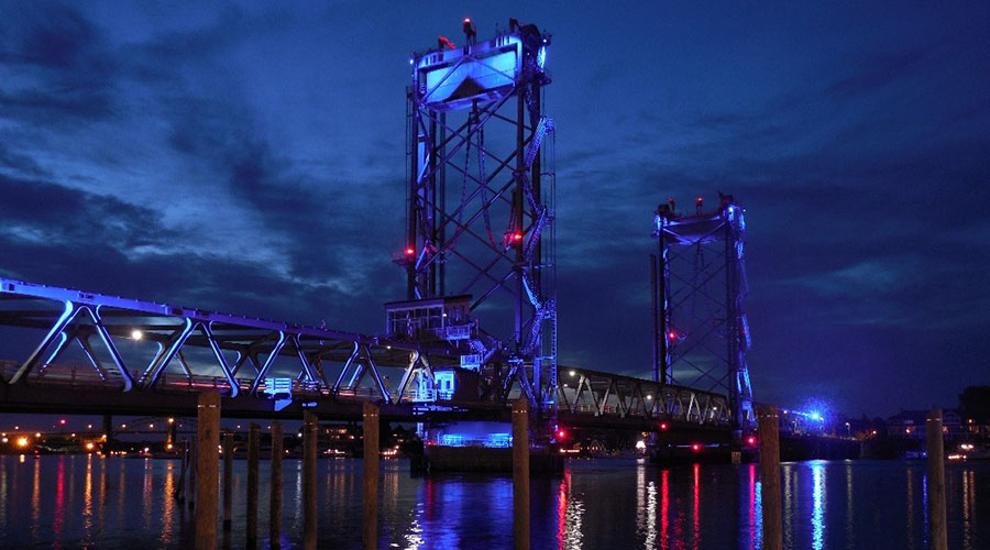 Memorial Bridge illuminated in blue at night over the Piscataqua River